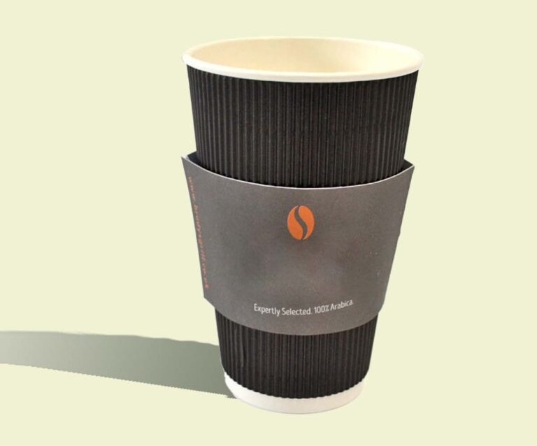Custom printed coffee sleeves fitted to takeaway hot cups on a counter