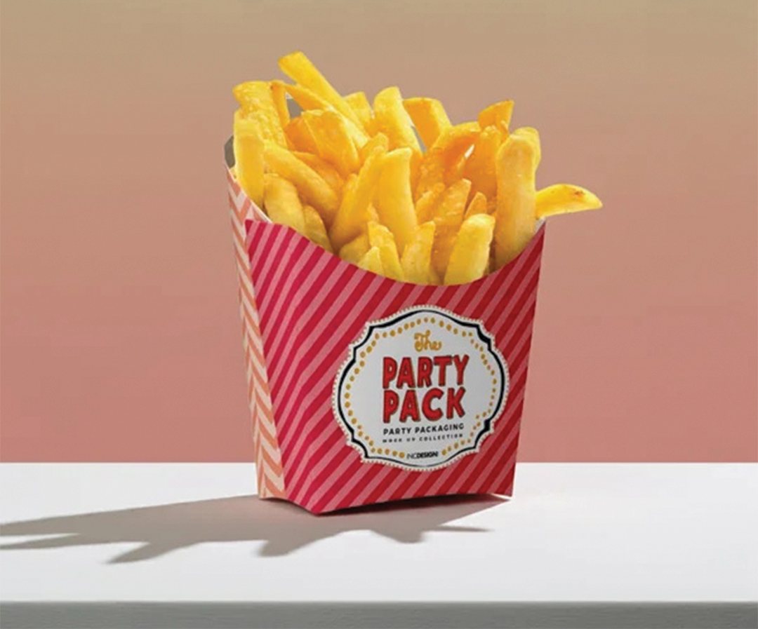 Red and white striped fry carton filled with fries